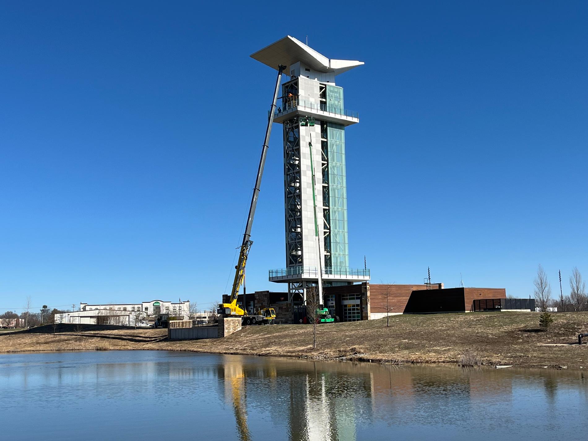 Tower with crane and pond